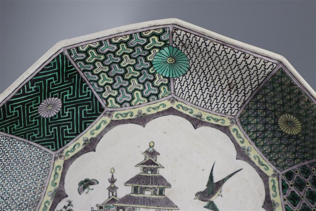 An unusual Chinese famille verte decorated biscuit porcelain twelve sided dish, 19th century in Kangxi style, 26cm wide